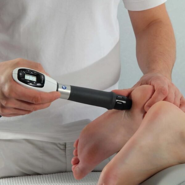 Shockwave therapy device applied to a patient's heel